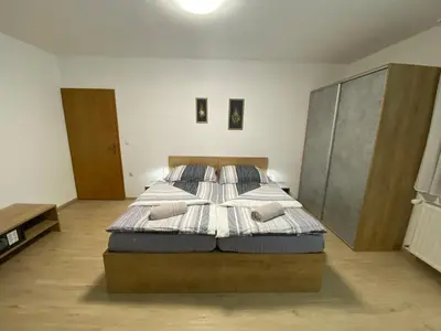 a bedroom with a bed in a room at APARTMA BRDO BC in Bovec