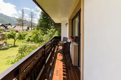 a balcony with a view of a yard at Pod Koblo Bohinj Apartments in Bohinj