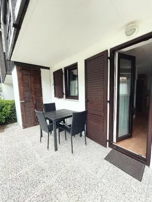 a patio with a table and chairs on a patio at Apartma Kati in Bovec