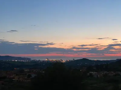 a view of a city at sunset at Apartma Mija-Dekani in Dekani