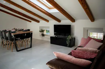 a living room with a couch and a table at Apartmaji na placu in Renče