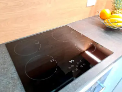 a microwave oven with a bowl of fruit on a counter at Juliana Apartment Bohinj Lake in Bohinj