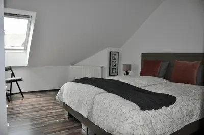 a bedroom with a large bed and a window at Appartment Pri Nacu in Bled