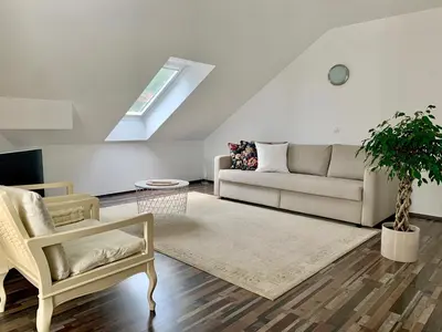 a living room with a couch and a rug at Appartment Pri Nacu in Bled