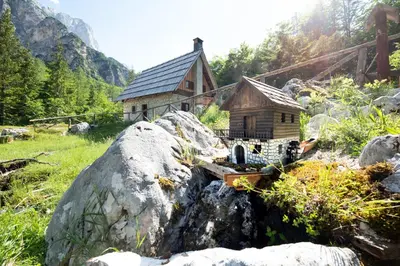 a small house sitting on top of a pile of rocks at Mountain heart holiday house in Trenta