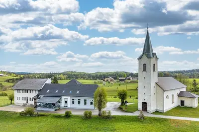 an aerial view of a church with a steeple at Apartma Sveti Duh in Nova Vas