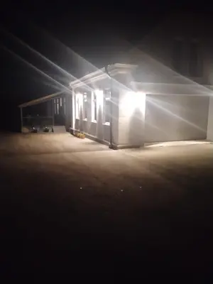a building lit up at night with lights at Apartma Sveti Duh in Nova Vas