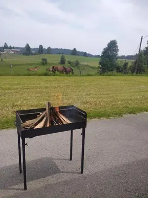 a fire pit sitting on the side of a road at Apartma Sveti Duh in Nova Vas