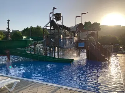 a water park with a slide in the water at Hiška Marjetica in Podčetrtek