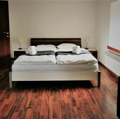 a bed with two pillows on it in a bedroom at Natur pur Pikovo in Črna na Koroškem