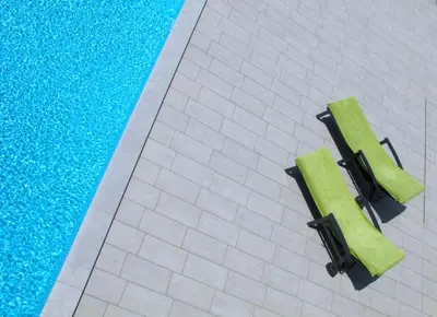 an overhead view of a swimming pool with green seats at Villa Lavanda in Kriz Sezana with private swimpool in Sežana