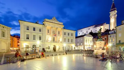 a group of buildings in a city at night at Villa Lavanda in Kriz Sezana with private swimpool in Sežana