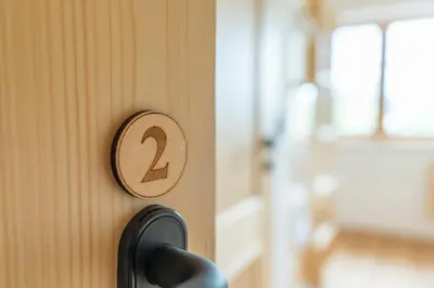 a wooden door with the number two on it at Planinska koča na Uskovnici in Srednja Vas v Bohinju