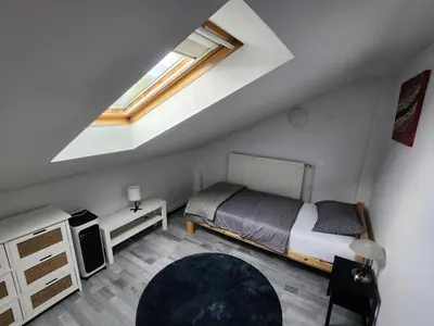 a small bedroom with a bed and a window at Rose 8 Bled in Bled