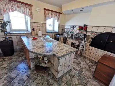 a kitchen with a counter top and a sink at Charming village house with patio and garden in Slovenske Konjice