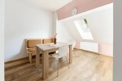 a dining room with a table and chairs at Apartmaji Rupnik in Bohinjska Bistrica