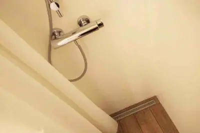 a shower in the corner of a bathroom at OLD TOWN 14 in Ljubljana