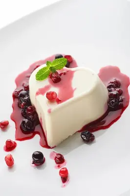 a piece of cake with red sauce and cherries at Hiša Ančka, Šenčur - 3 min to the Airport in Kranj