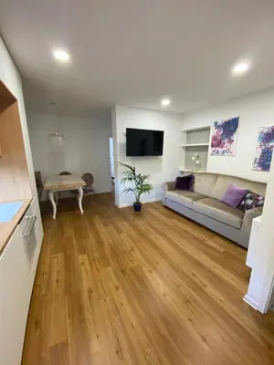 a living room with a couch and a table at Apartma pri nani in Kobarid