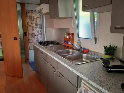 a kitchen with a sink and a counter top at Lexi Zen House in Kamnik