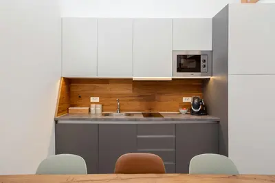 a kitchen with a sink and a microwave at SKI Gothia in Kranjska Gora