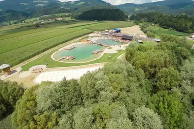 an aerial view of a lake in a field at Grandma's House in Radlje ob Dravi