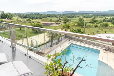 a swimming pool on the balcony of a house at Apartment THE VIEW HerMes arT in Sežana