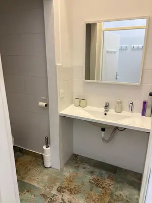 a bathroom with a sink and a mirror at INDUSTRIAL STUDIO 2 in Ljubljana