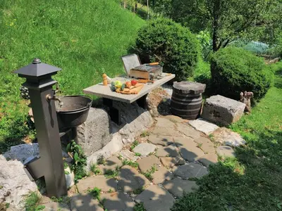a picnic table with fruits and vegetables on it at Apartma Dobra misel in Bovec