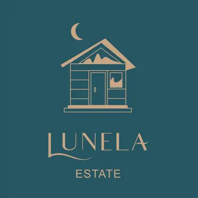 a logo of a house with a moon and the words luna estate at Lunela estate with sauna in Cerklje na Gorenjskem
