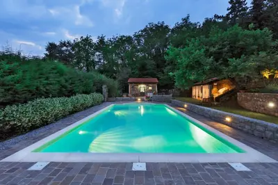 a swimming pool in a backyard with a gazebo at 9b-The Tiny House in Sežana