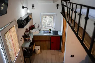 a small kitchen with a sink and a counter at 9b-The Tiny House in Sežana