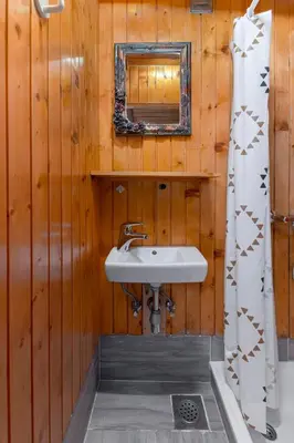 a bathroom with a sink and a mirror at Apartmaji Marko in Bled