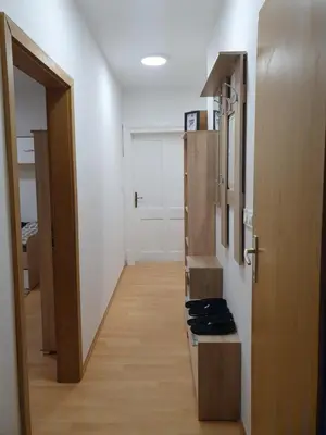 a room with a hallway with a door and a room with at RAILWAY STATION CITY MODERN APARTMENT in Maribor