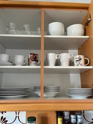 a cabinet filled with plates and cups and saucers at Apartma Tanya Bled in Bled