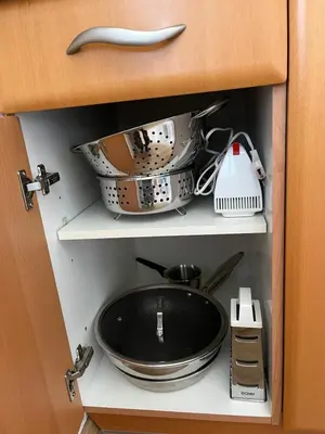a cupboard with a frying pan anduclearuclearuclearuclearuclearuclearuclearuclear at Apartma Tanya Bled in Bled