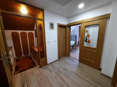 an empty room with a door and a hallway at Apartma Tanya Bled in Bled