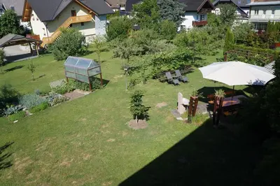 an overhead view of a garden with an umbrella at Apartma Tanya Bled in Bled