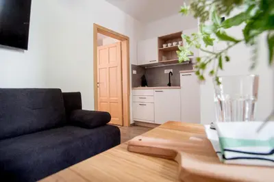 a living room with a couch and a table at Apartmaji-Utrinek 