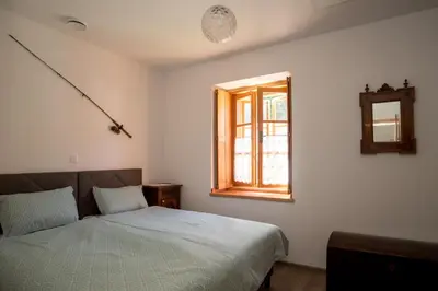 a bedroom with a bed and a window at Apartmaji-Utrinek 