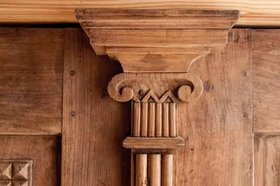 a wooden door with a column on the wall at Apartmaji-Utrinek 