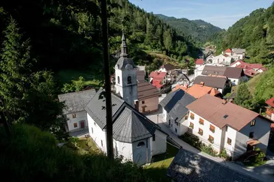 an aerial view of a village with a church at Apartmaji-Utrinek 