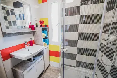 a bathroom with a sink and a shower at CUDERLAND - Petra in Kobarid