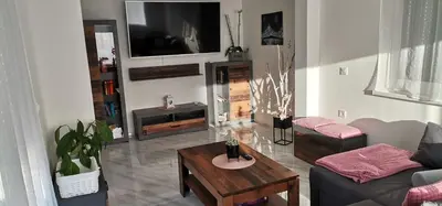 a living room with a couch and a table at Mali Portorož v Prlekiji in Ljutomer