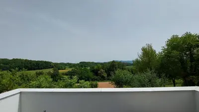 a view of a garden from the balcony of a house at Grajsko in Metlika