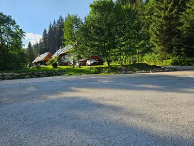 an empty road in front of a house at Glamping Tent Water Village Rogla in Oplotnica
