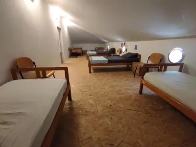 a room with several beds and a couch in a room at Park Istra holiday home in Koper