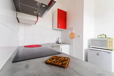 a kitchen with a counter with a tray on top of it at Soska 5 in Ljubljana