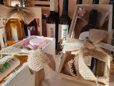 a bunch of bottles of wine sitting on a table at Rooms & Wine Lilek in Šentilj