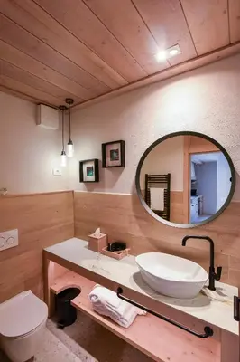 a bathroom with a sink and a mirror at JULIAN VILLAGE LEPENA in Soča
